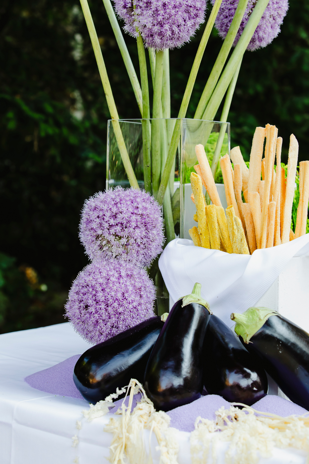 Convitio artful still life with eggplants and floral elements